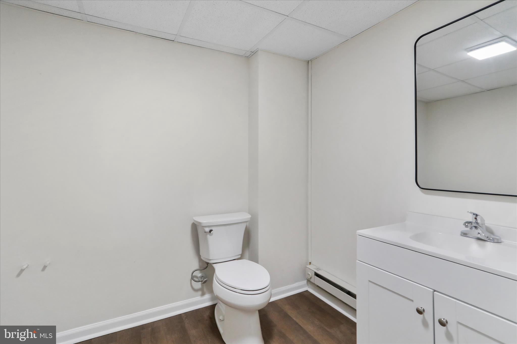 13 Oriole Circle Berkeley Springs, WV 25411 - Photo 29 of 36 a white toilet sitting next to a bathroom sink