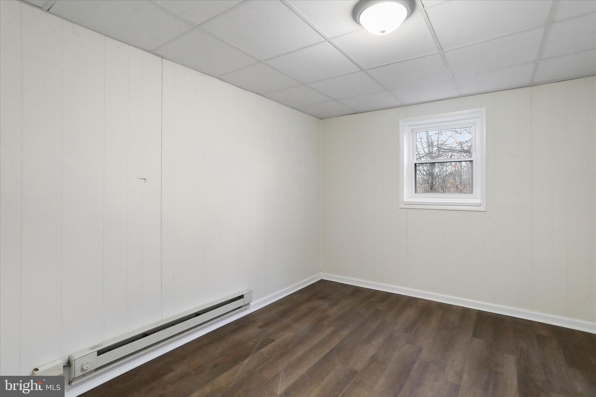 13 Oriole Circle Berkeley Springs, WV 25411 - Photo 30 of 36 an empty room with wooden floor and windows