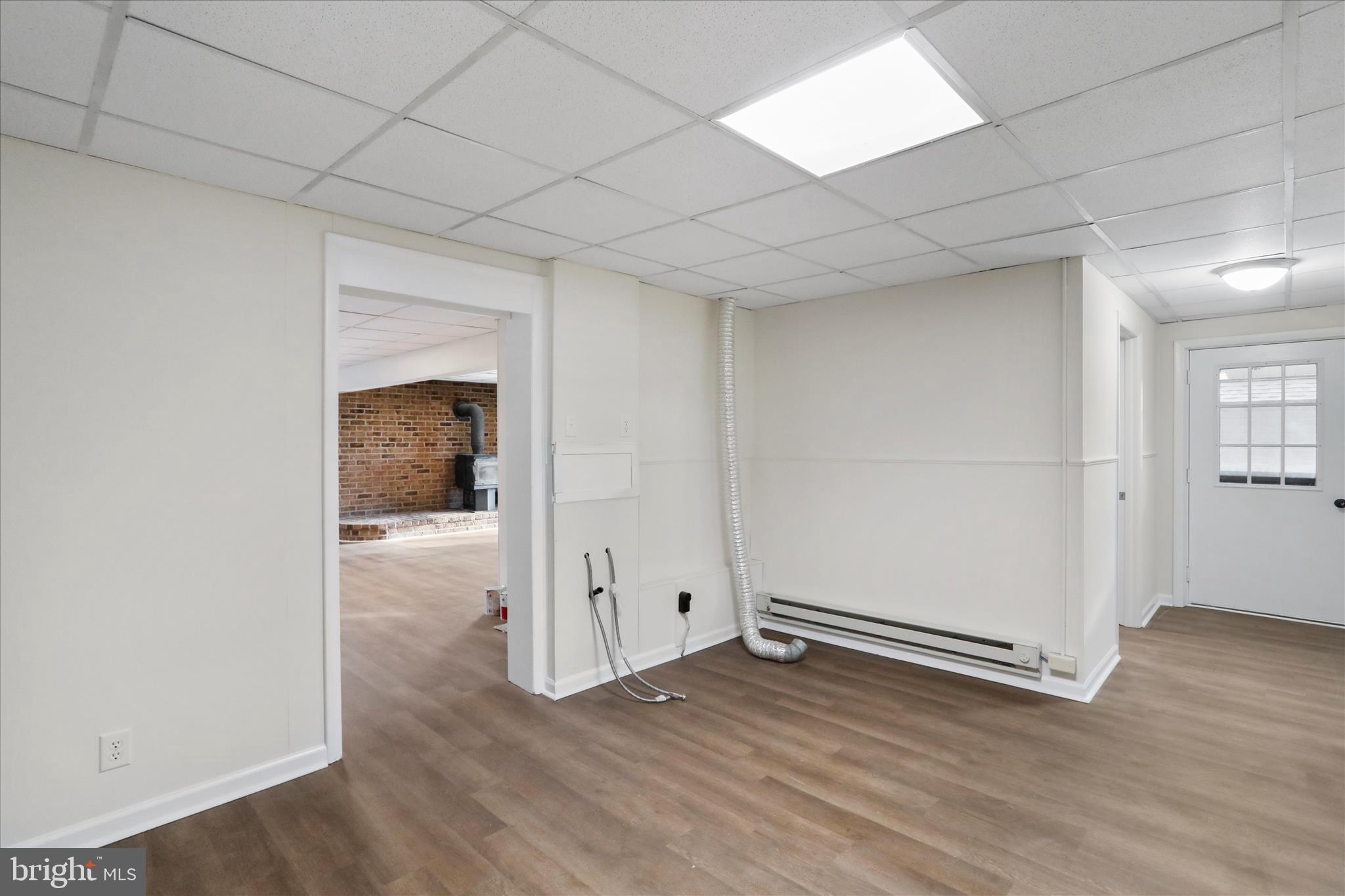 13 Oriole Circle Berkeley Springs, WV 25411 - Photo 33 of 36 an empty room with wooden floor and windows