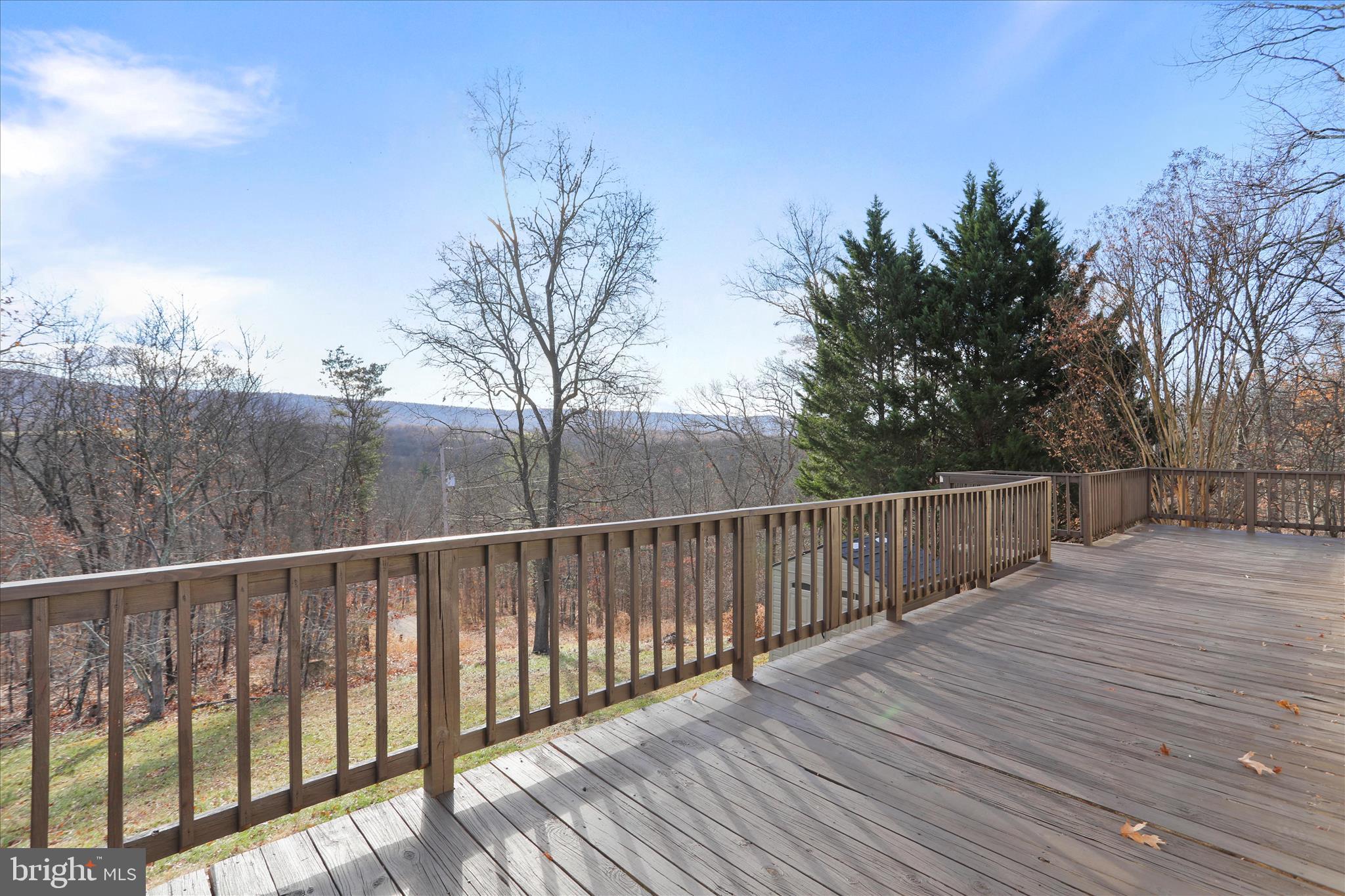 13 Oriole Circle Berkeley Springs, WV 25411 - Photo 7 of 36 a view of a balcony with wooden fence and floor