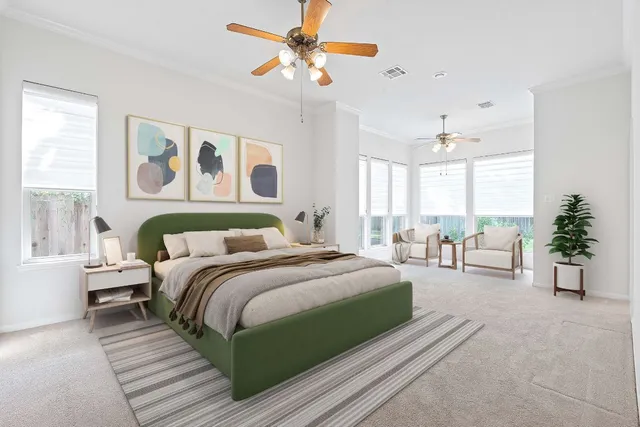 a spacious bedroom with a large bed and a chandelier