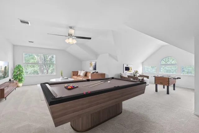 a bed room with furniture and a chandelier