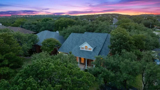 an aerial view of a house with mountain view