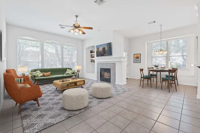 a living room with furniture and a fireplace