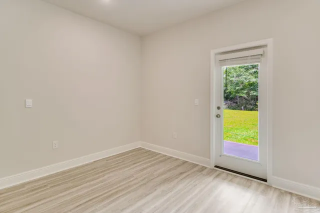 a view of an empty room and window