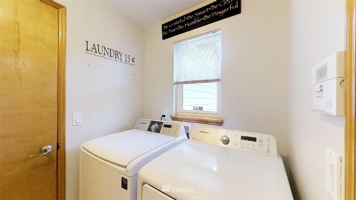 18607 104th Place Southeast Renton, WA 98055 - Photo 13 of 22 a utility room with dryer and window