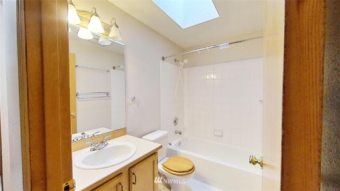 18607 104th Place Southeast Renton, WA 98055 - Photo 18 of 22 a bathroom with a sink a toilet and shower