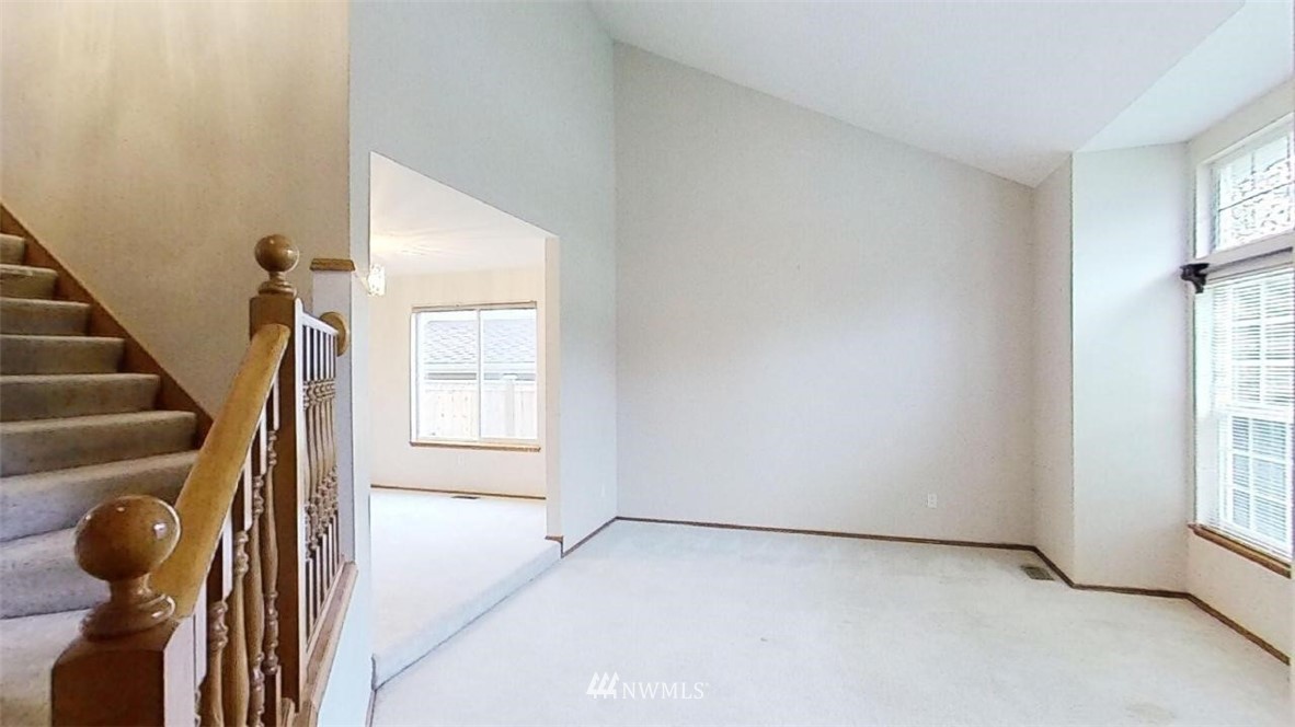 18607 104th Place Southeast Renton, WA 98055 - Photo 3 of 22 a view of an empty room with windows