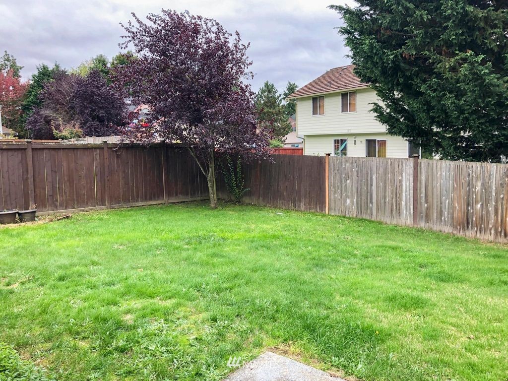 18607 104th Place Southeast Renton, WA 98055 - Photo 22 of 22 a view of a house with a yard and wooden fence