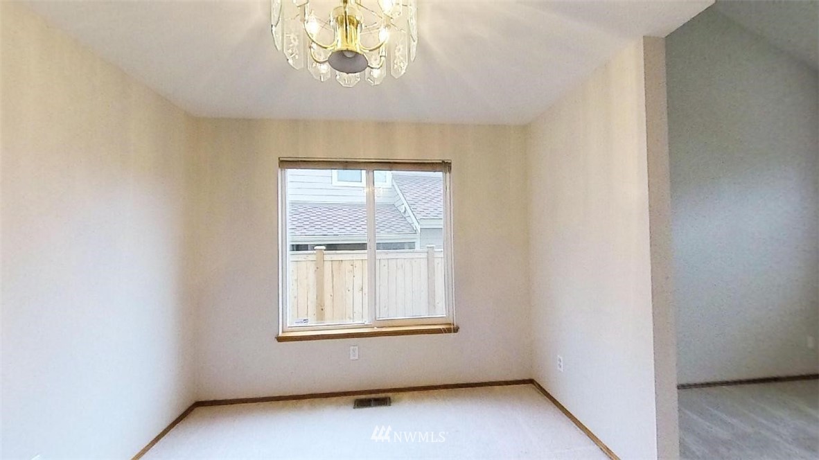 18607 104th Place Southeast Renton, WA 98055 - Photo 5 of 22 an empty room with windows