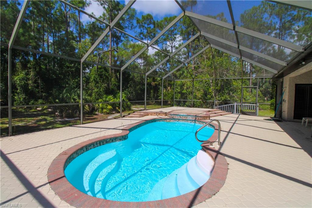a view of a swimming pool with a patio