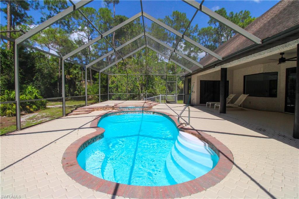 311 31st Street Northwest Naples, FL 34120 - Photo 12 of 50 a view of a swimming pool with a patio