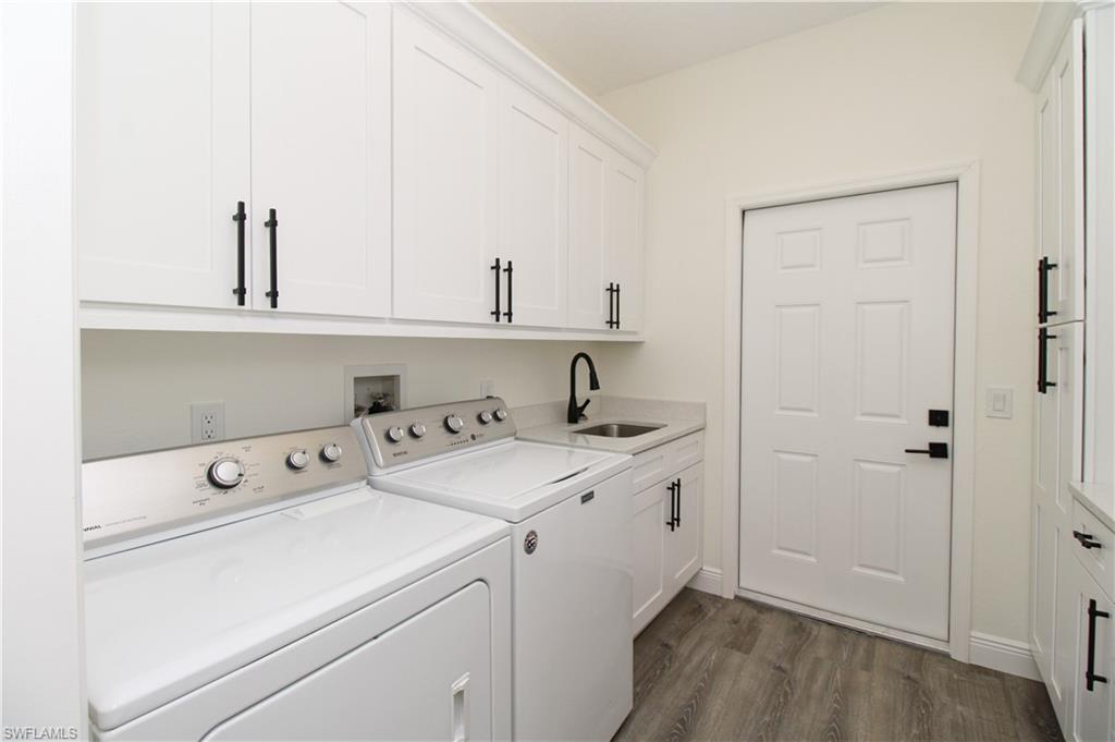 311 31st Street Northwest Naples, FL 34120 - Photo 42 of 50 a view of storage and utility room with washer and dryer