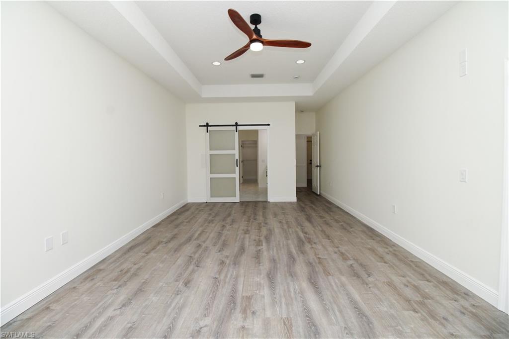 311 31st Street Northwest Naples, FL 34120 - Photo 43 of 50 wooden floor in an empty room