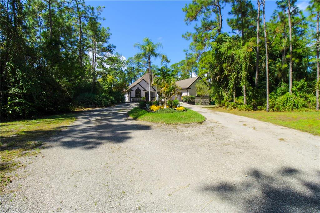 311 31st Street Northwest Naples, FL 34120 - Photo 5 of 50 a view of a playground with basketball court
