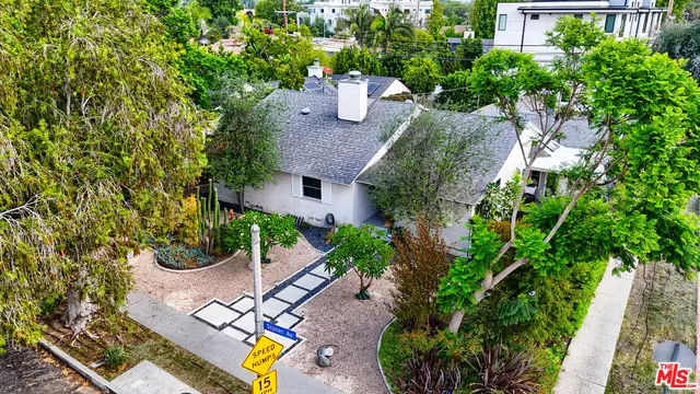 an aerial view of a house with a garden