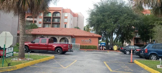 a front view of a house with parking space