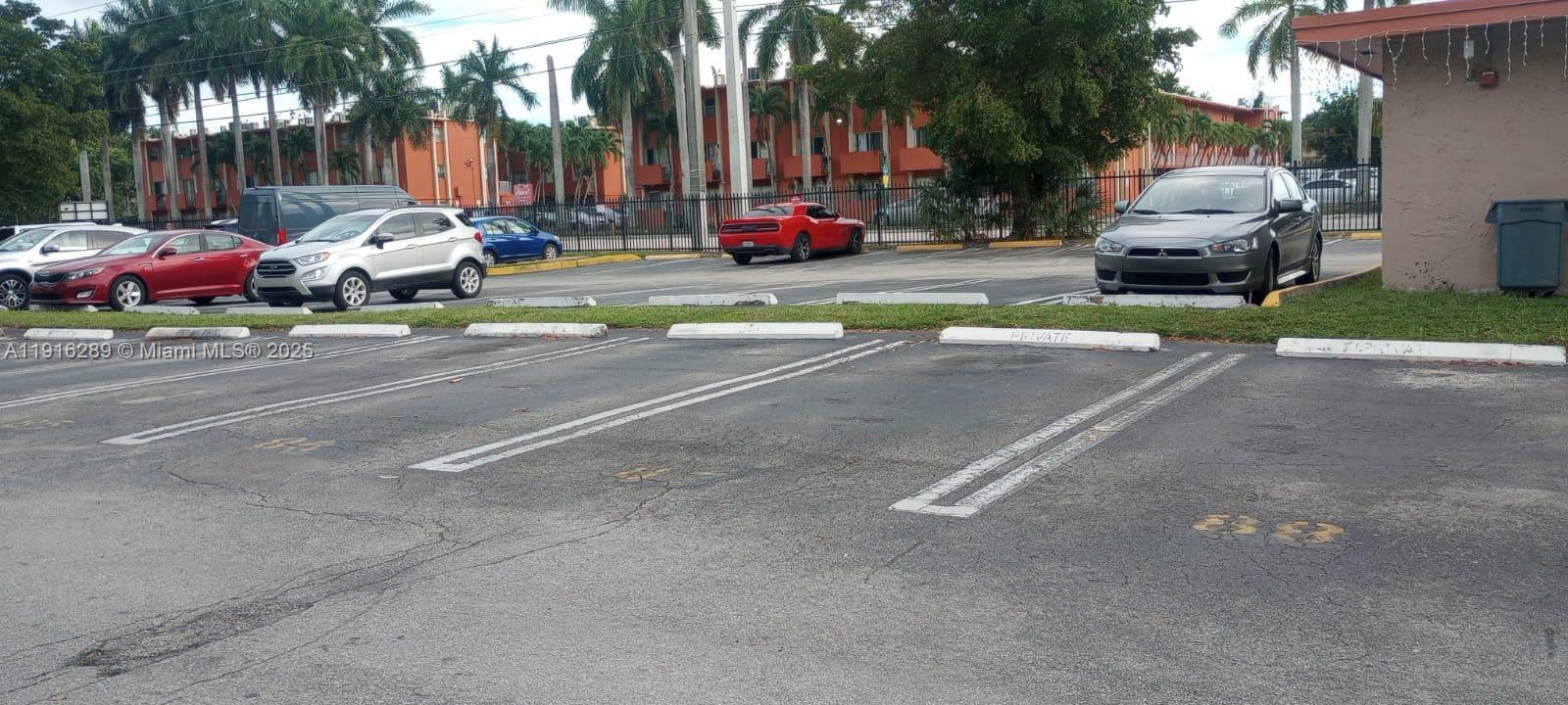 5201 Northwest 7th Street, Unit 405 Miami, FL 33126 - Photo 10 of 10 a car parked in front of a house