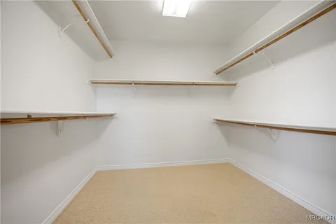 a view of a room with shelf on the wall