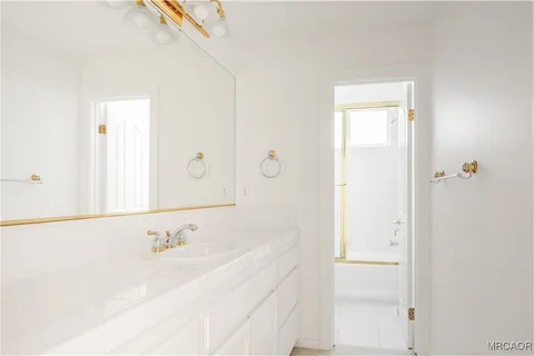 a bathroom with a bathtub and a sink