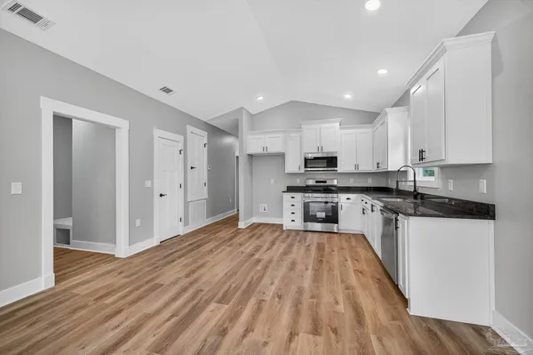 a large kitchen with cabinets
