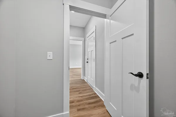 a bathroom with a granite countertop toilet sink and mirror