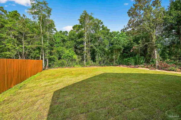 a house with trees in the background