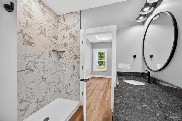 a bathroom with a sink and a mirror