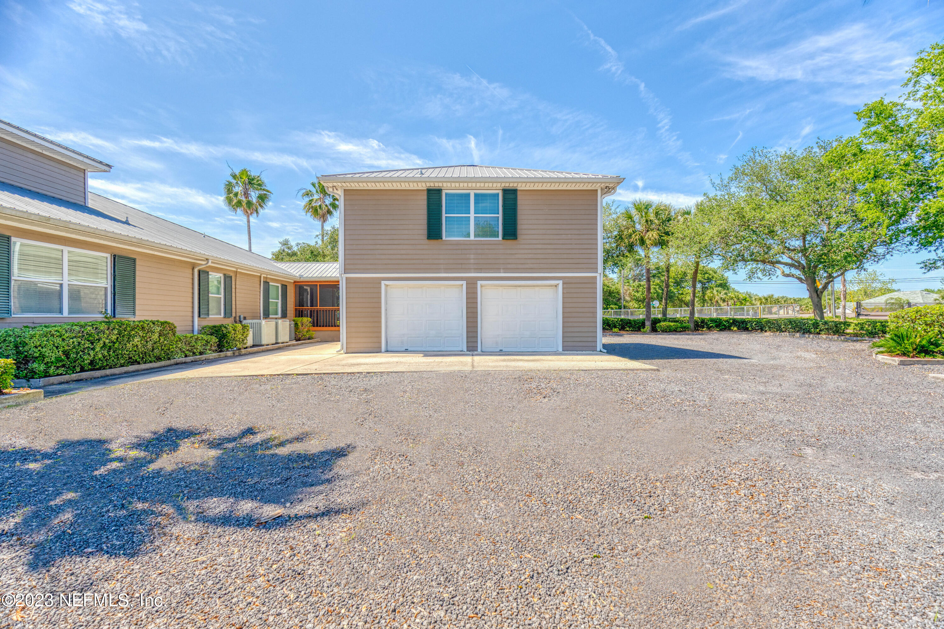 9636 Heckscher Drive Jacksonville, FL 32226 - Photo 11 of 43 a house with lots of trees in the background
