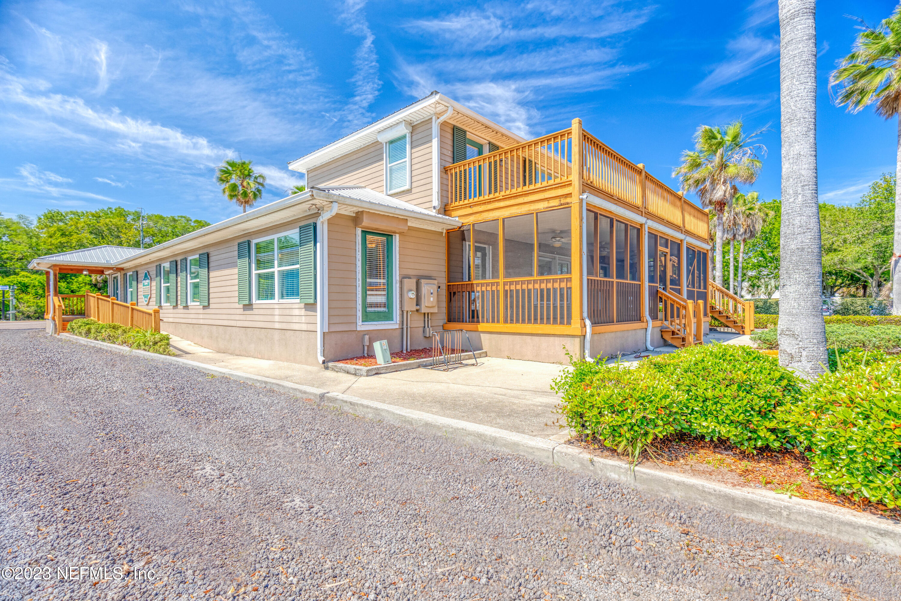 9636 Heckscher Drive Jacksonville, FL 32226 - Photo 12 of 43 a front view of a house with a yard