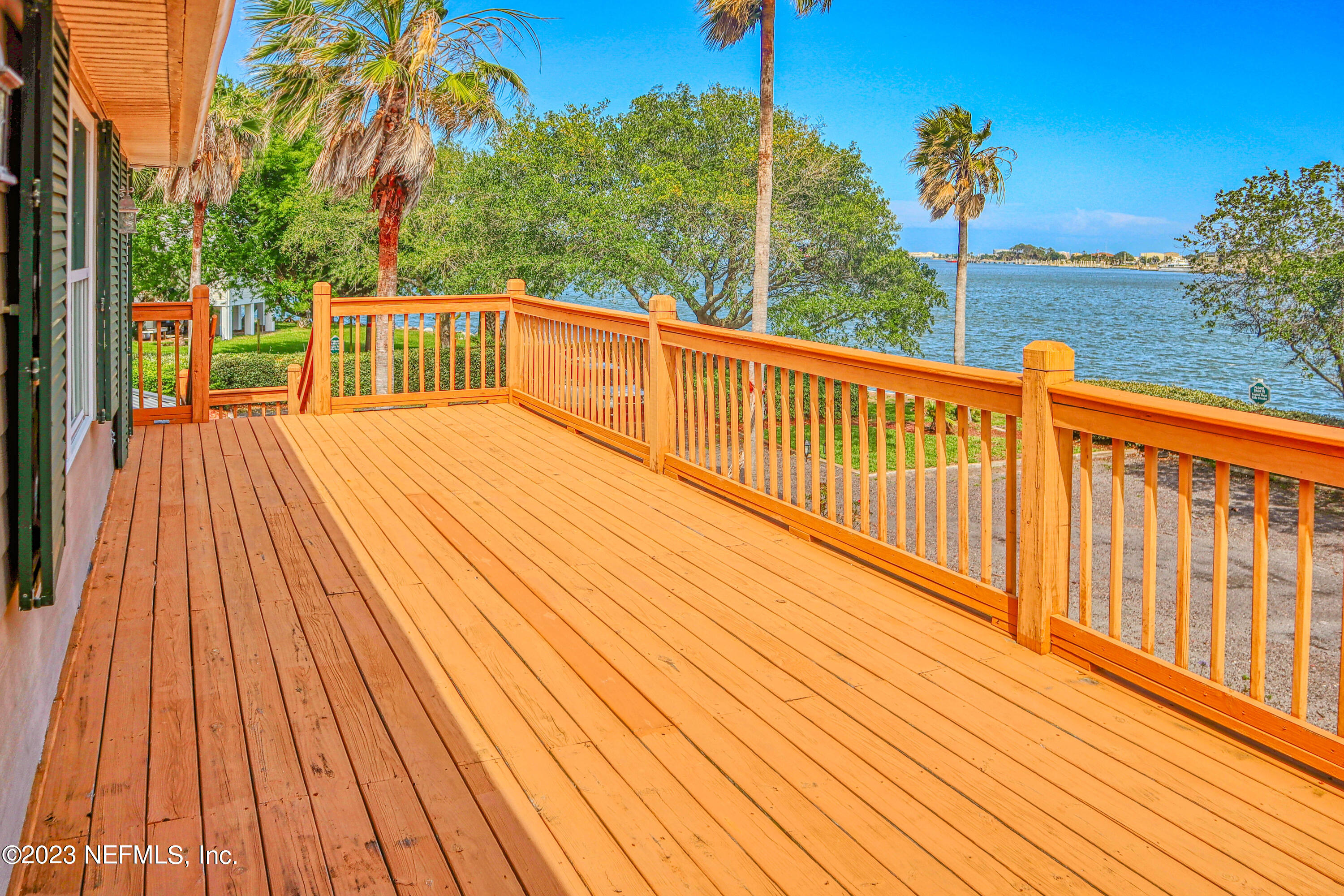 9636 Heckscher Drive Jacksonville, FL 32226 - Photo 20 of 43 a view of a wooden deck with a yard