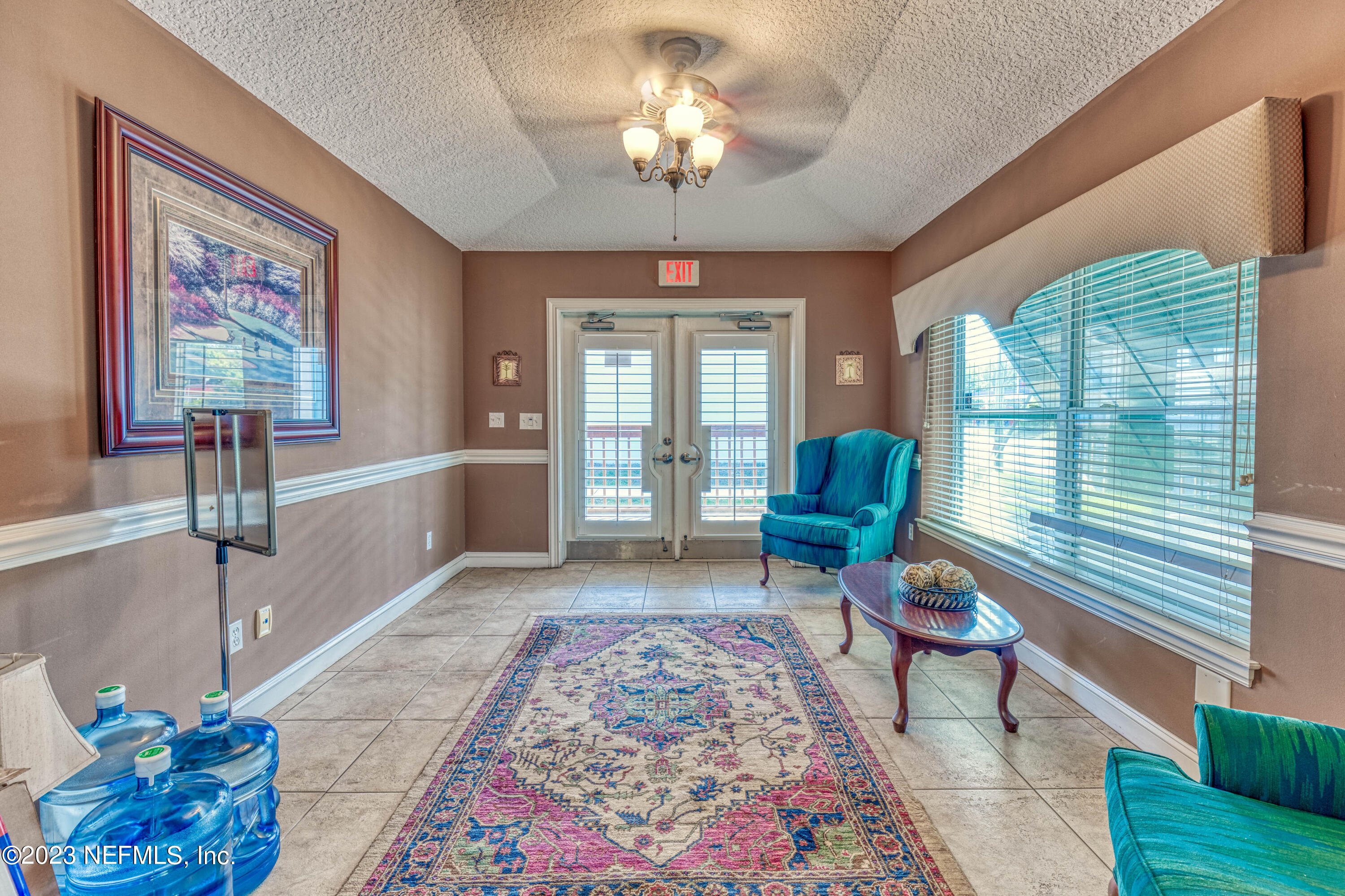 9636 Heckscher Drive Jacksonville, FL 32226 - Photo 24 of 43 a living room with furniture and a large window