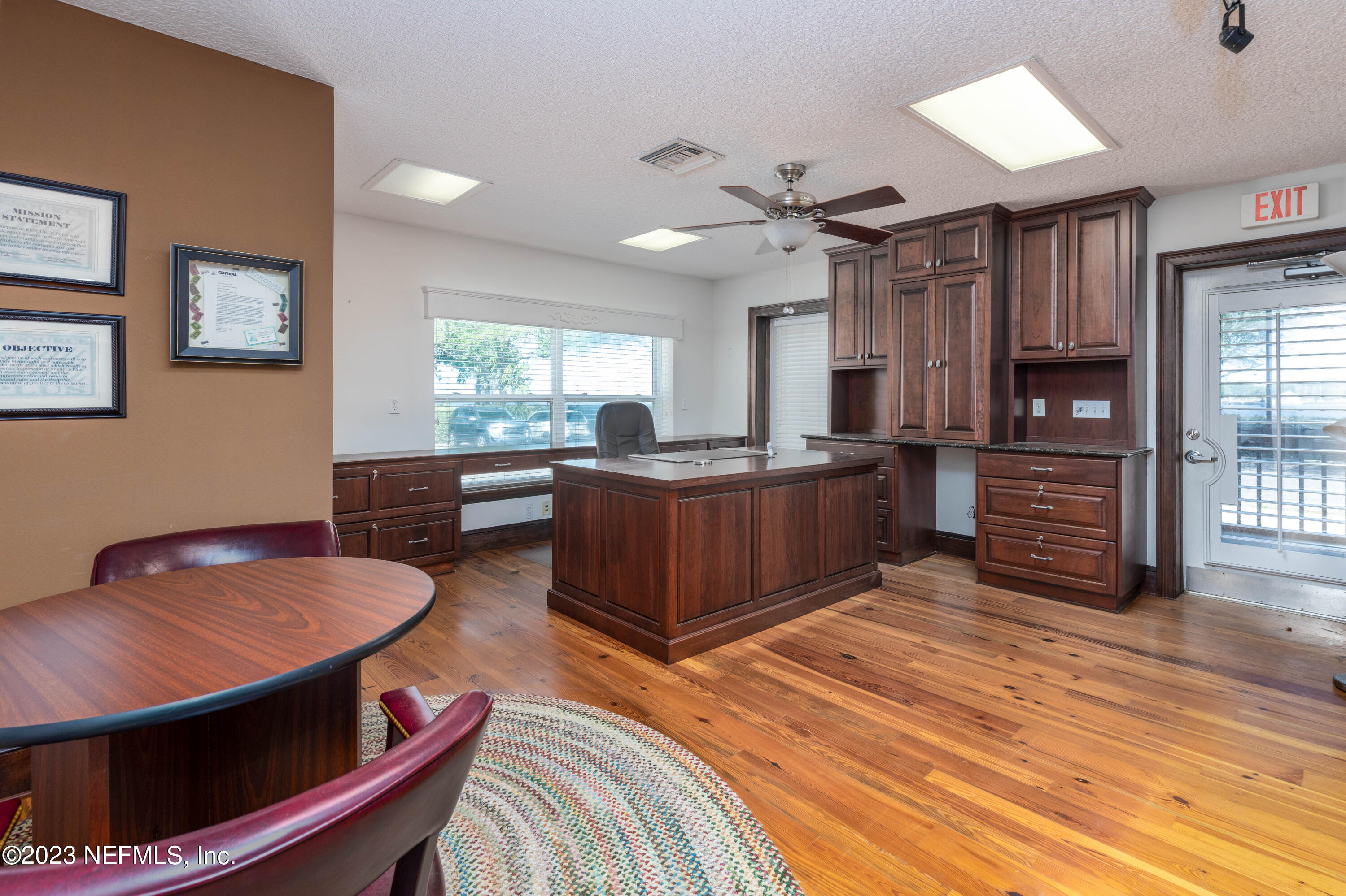 9636 Heckscher Drive Jacksonville, FL 32226 - Photo 31 of 43 a living room with furniture a flat screen tv and kitchen view