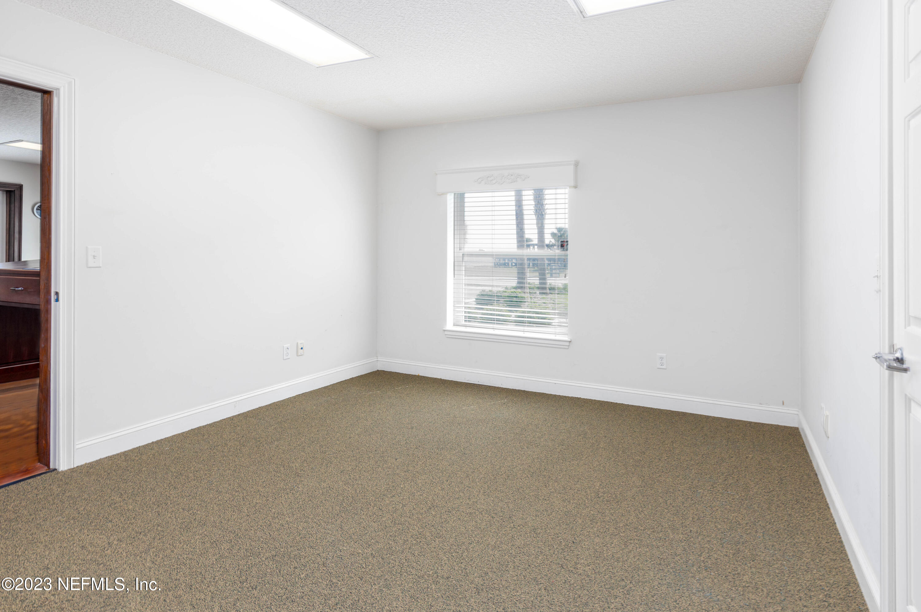 9636 Heckscher Drive Jacksonville, FL 32226 - Photo 32 of 43 an empty room with windows