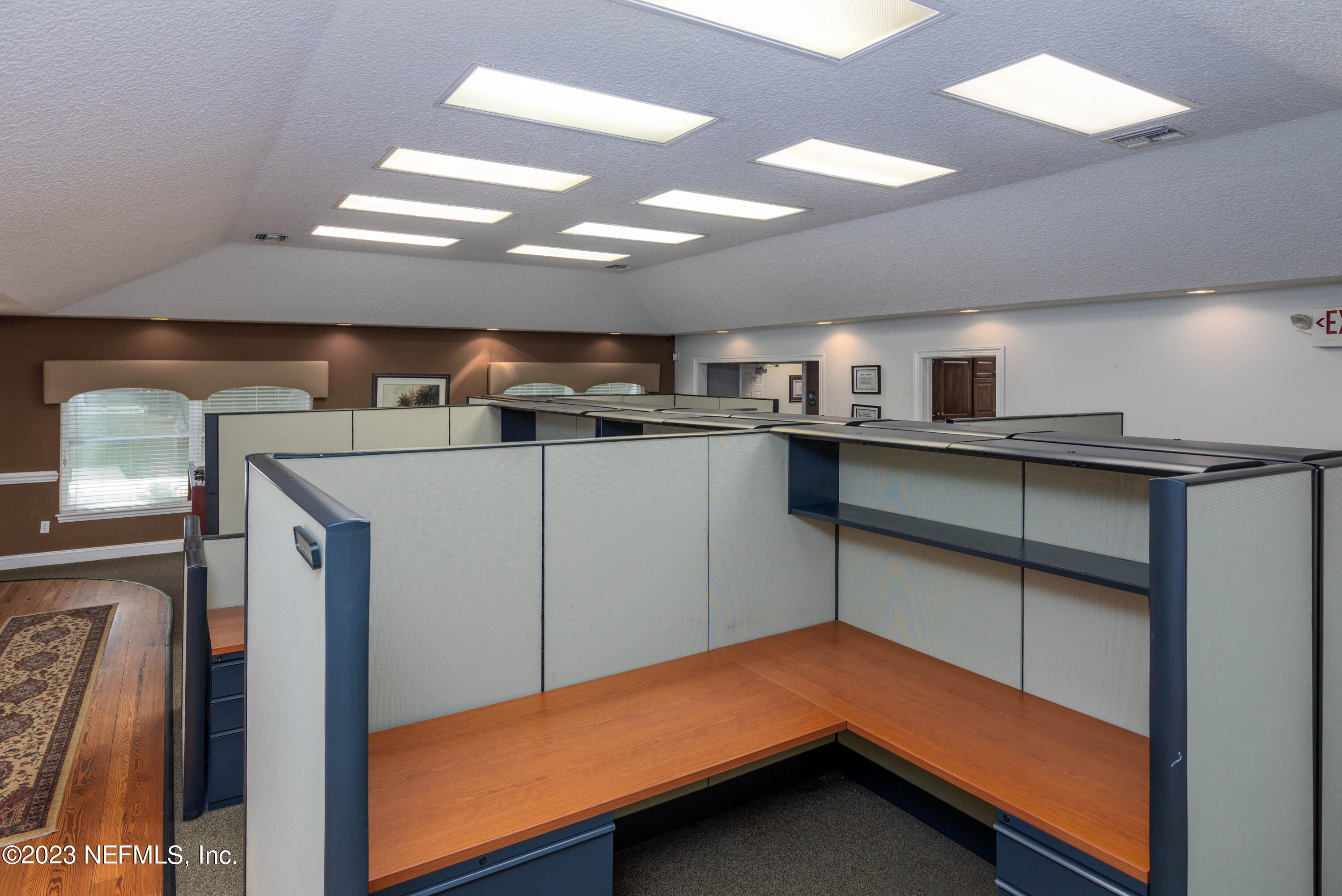 9636 Heckscher Drive Jacksonville, FL 32226 - Photo 34 of 43 a kitchen with stainless steel appliances kitchen island a chandelier