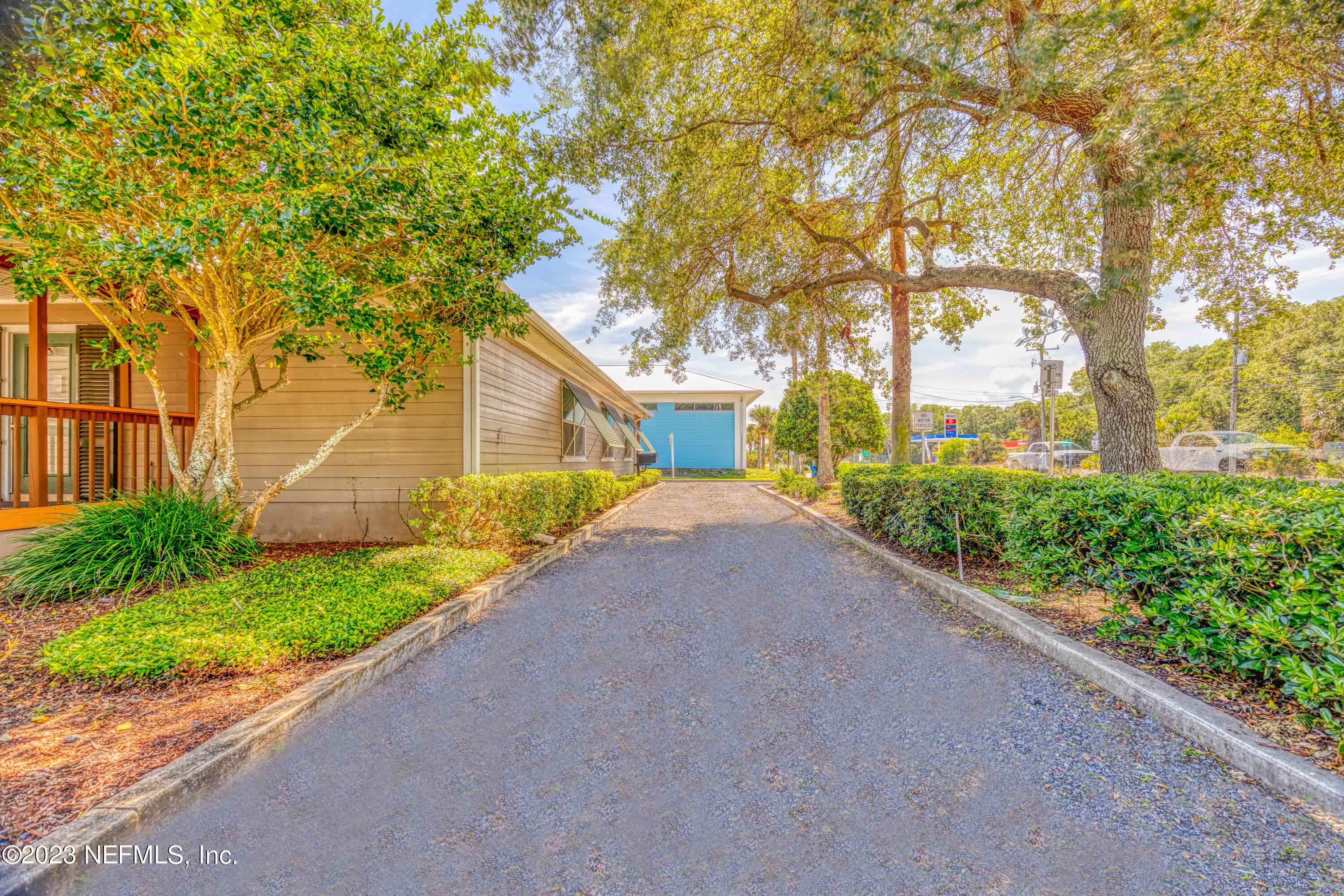 9636 Heckscher Drive Jacksonville, FL 32226 - Photo 5 of 43 a view of a house with a yard and potted plants