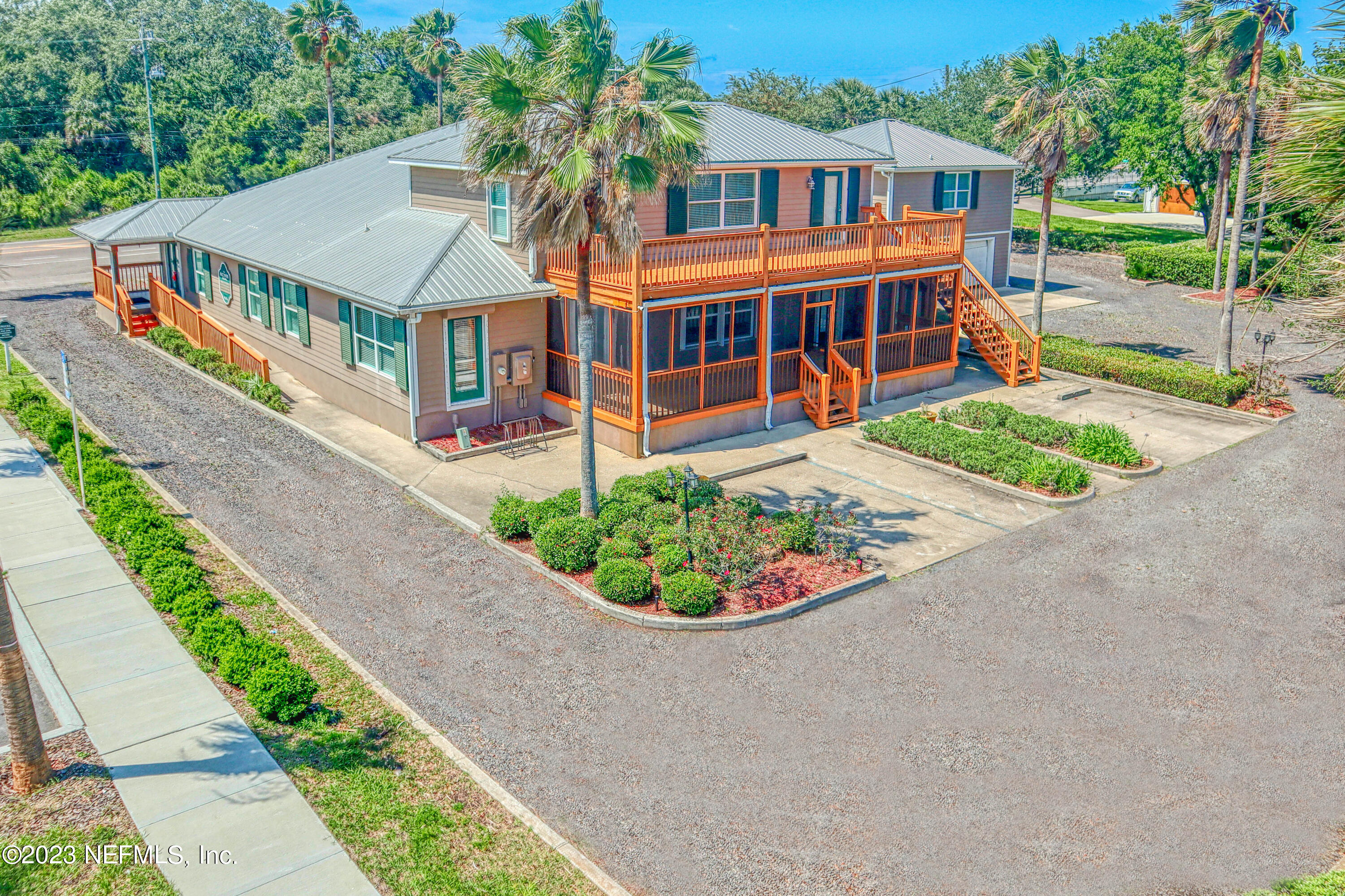 9636 Heckscher Drive Jacksonville, FL 32226 - Photo 6 of 43 a view of a house with a yard and potted plants