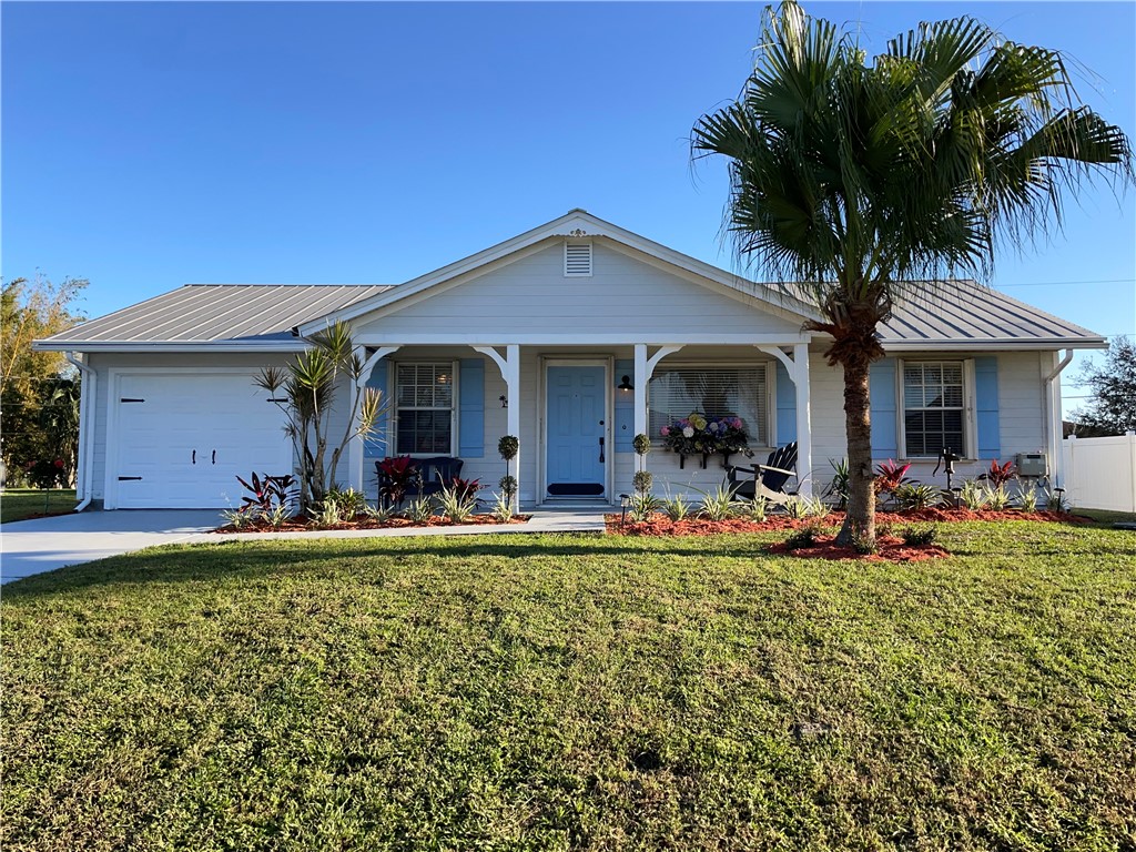 810 Southwest Commonwealth Road Port St. Lucie, FL 34953 - Photo 1 of 21 a view of a house with swimming pool and porch