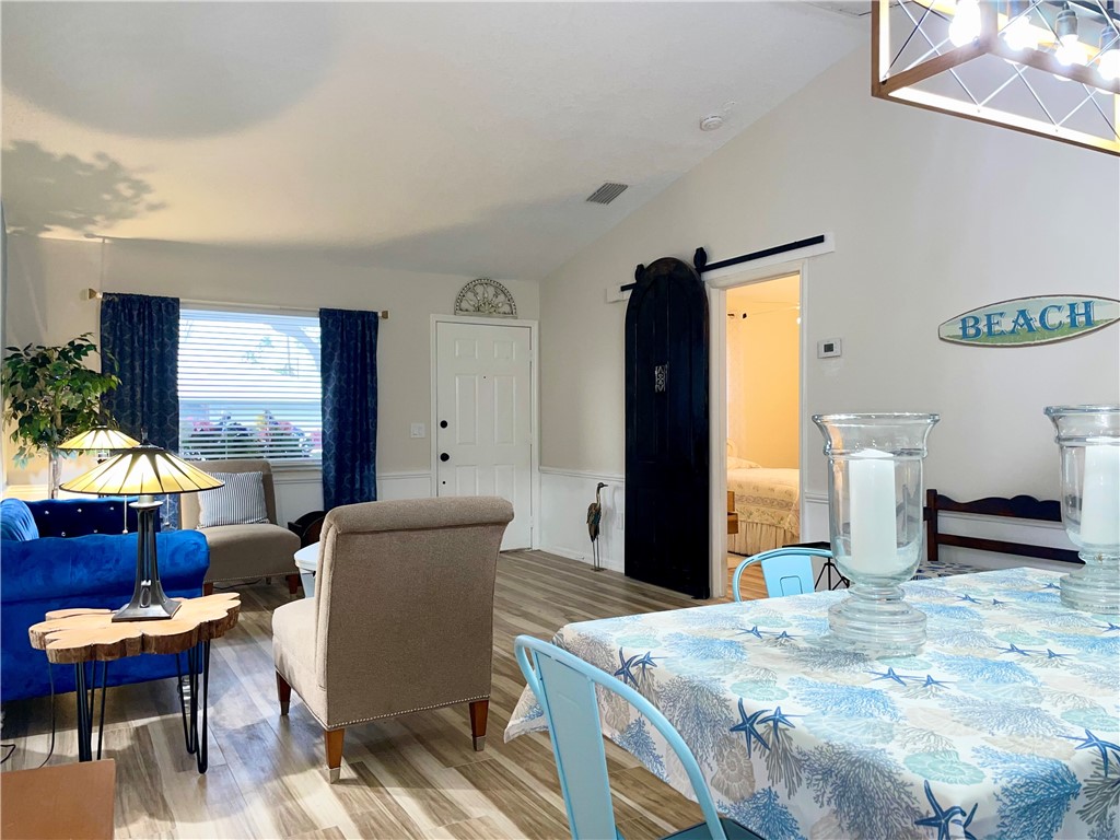 810 Southwest Commonwealth Road Port St. Lucie, FL 34953 - Photo 11 of 21 a bedroom with a bed and a table in it