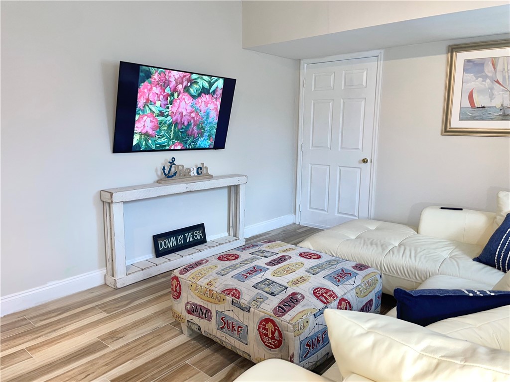 810 Southwest Commonwealth Road Port St. Lucie, FL 34953 - Photo 18 of 21 a bedroom with a bed and a flat screen tv