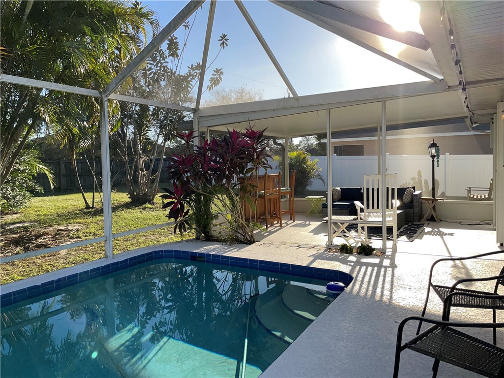 810 Southwest Commonwealth Road Port St. Lucie, FL 34953 - Photo 4 of 21 a view of a chairs and table in patio