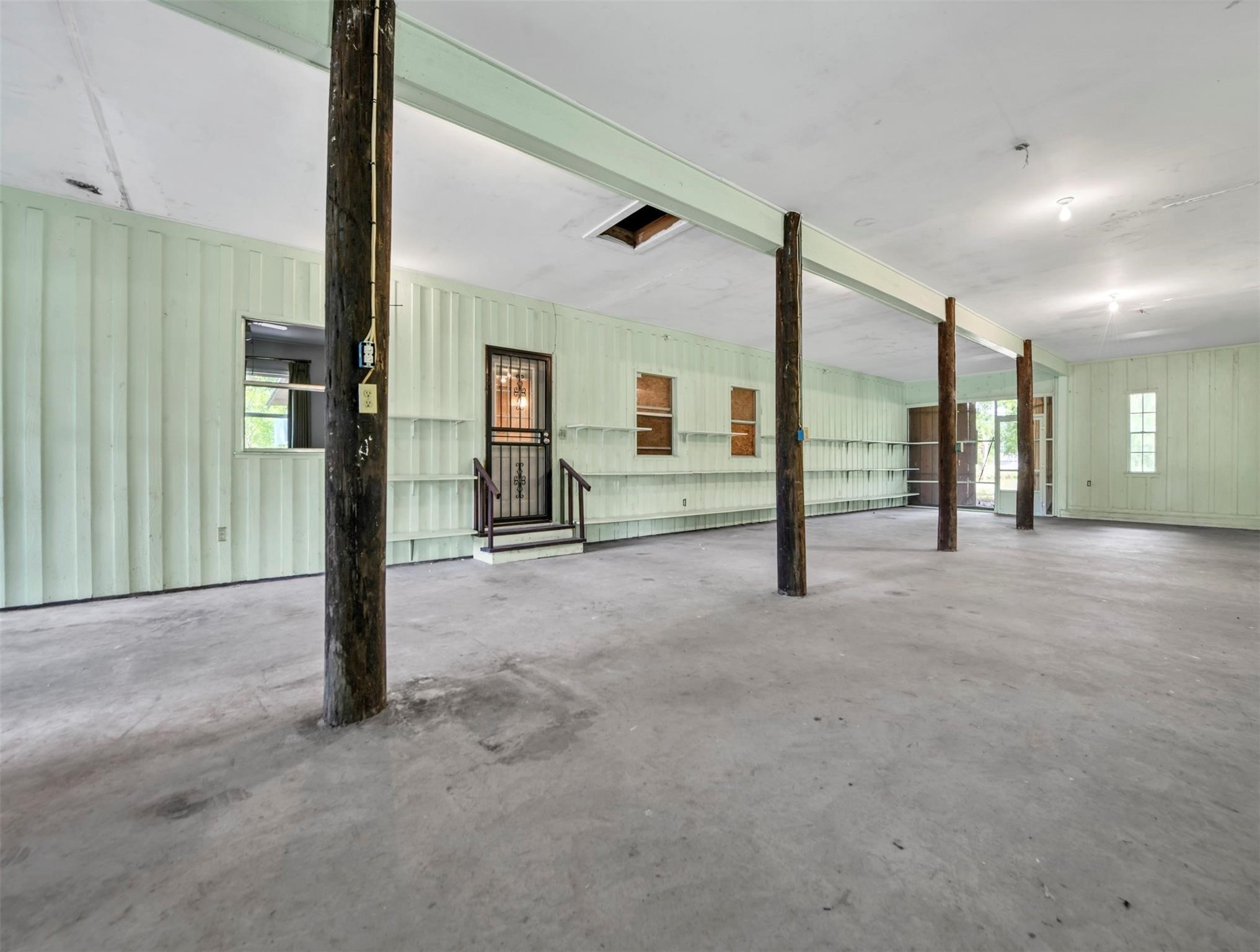 11304 Fostoria Road Cleveland, TX 77328 - Photo 16 of 32 a view of a hallway with staircase
