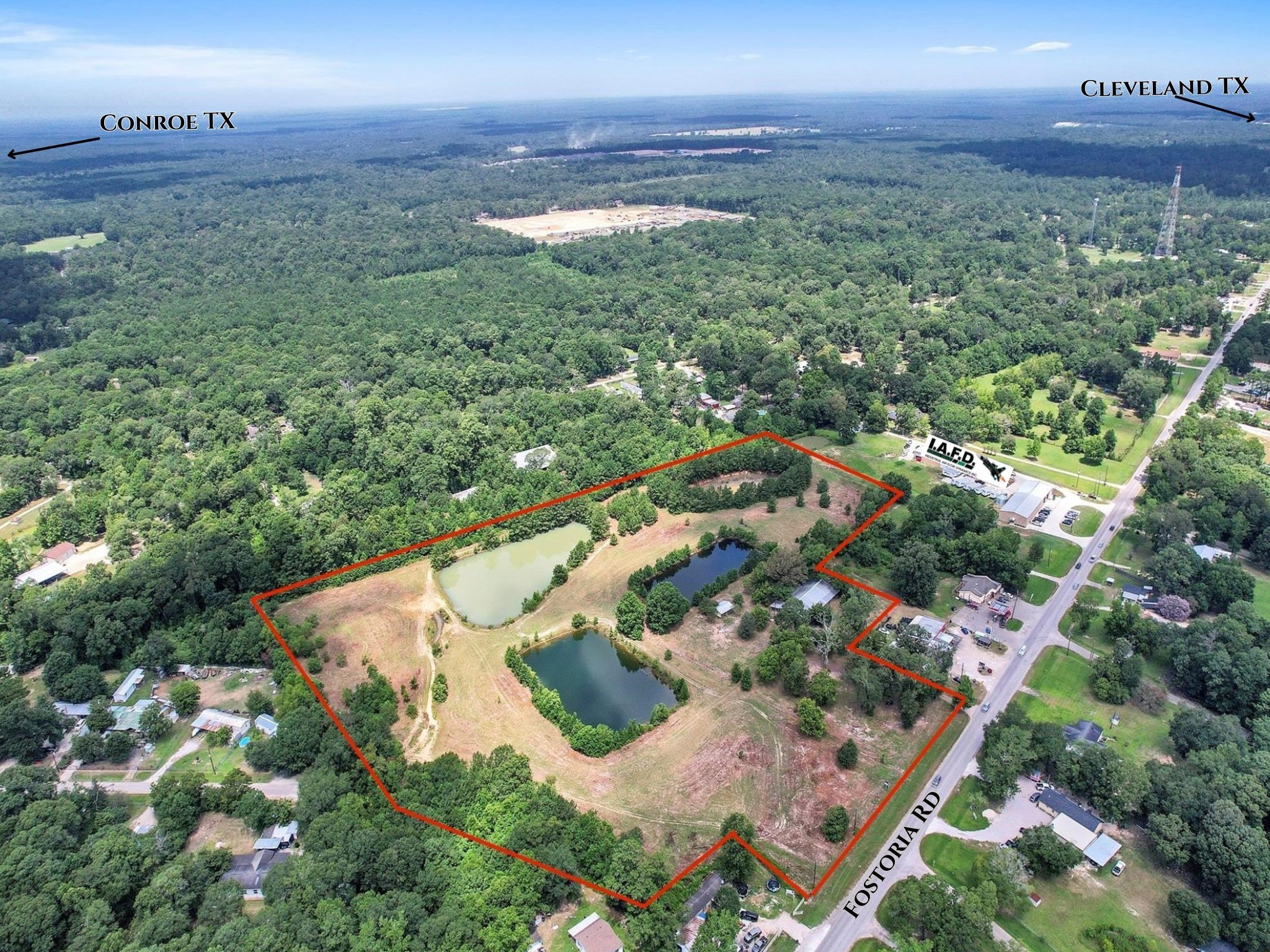 11304 Fostoria Road Cleveland, TX 77328 - Photo 2 of 32 an aerial view of residential houses with outdoor space and trees all around