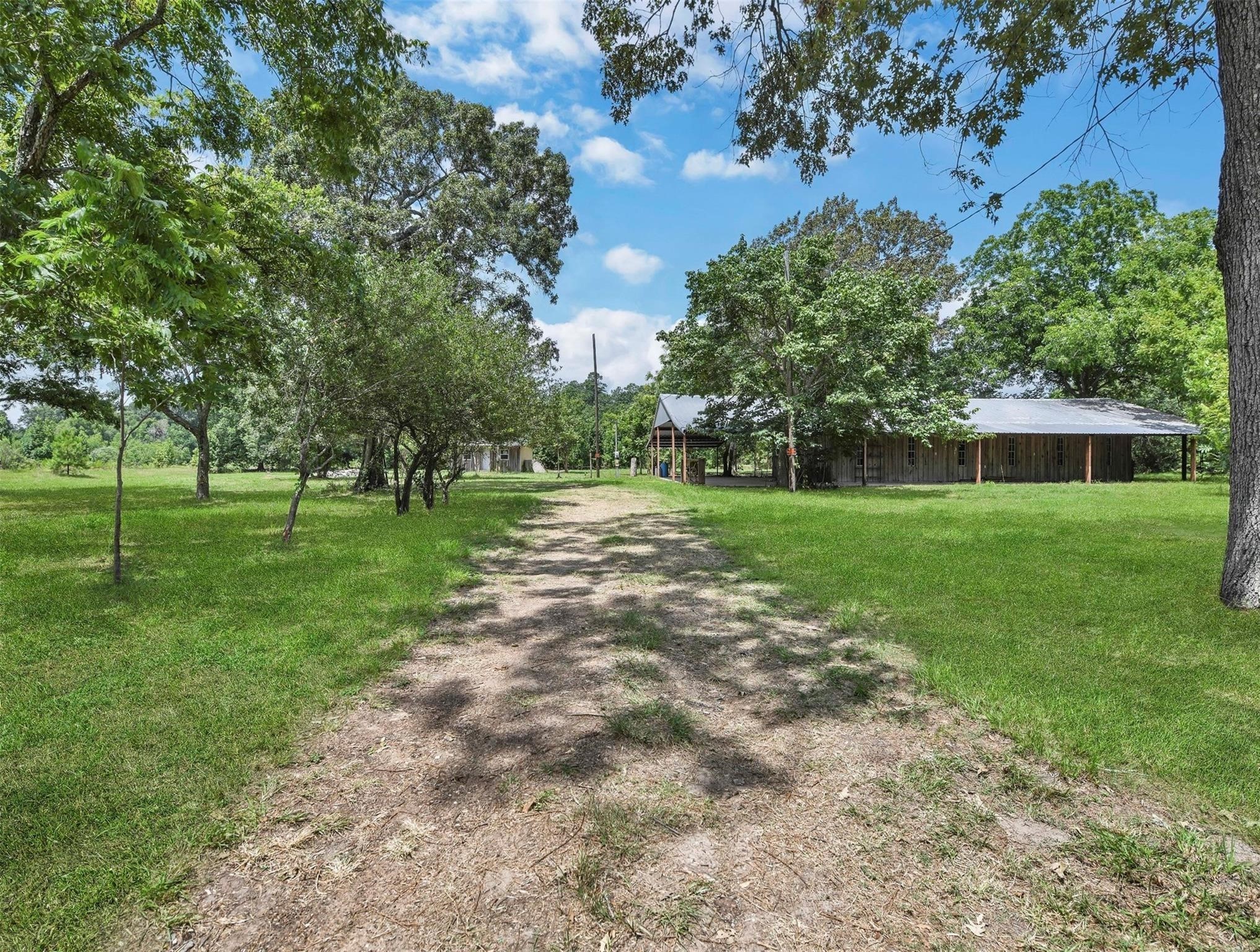 11304 Fostoria Road Cleveland, TX 77328 - Photo 27 of 32 a view of a house with a big yard