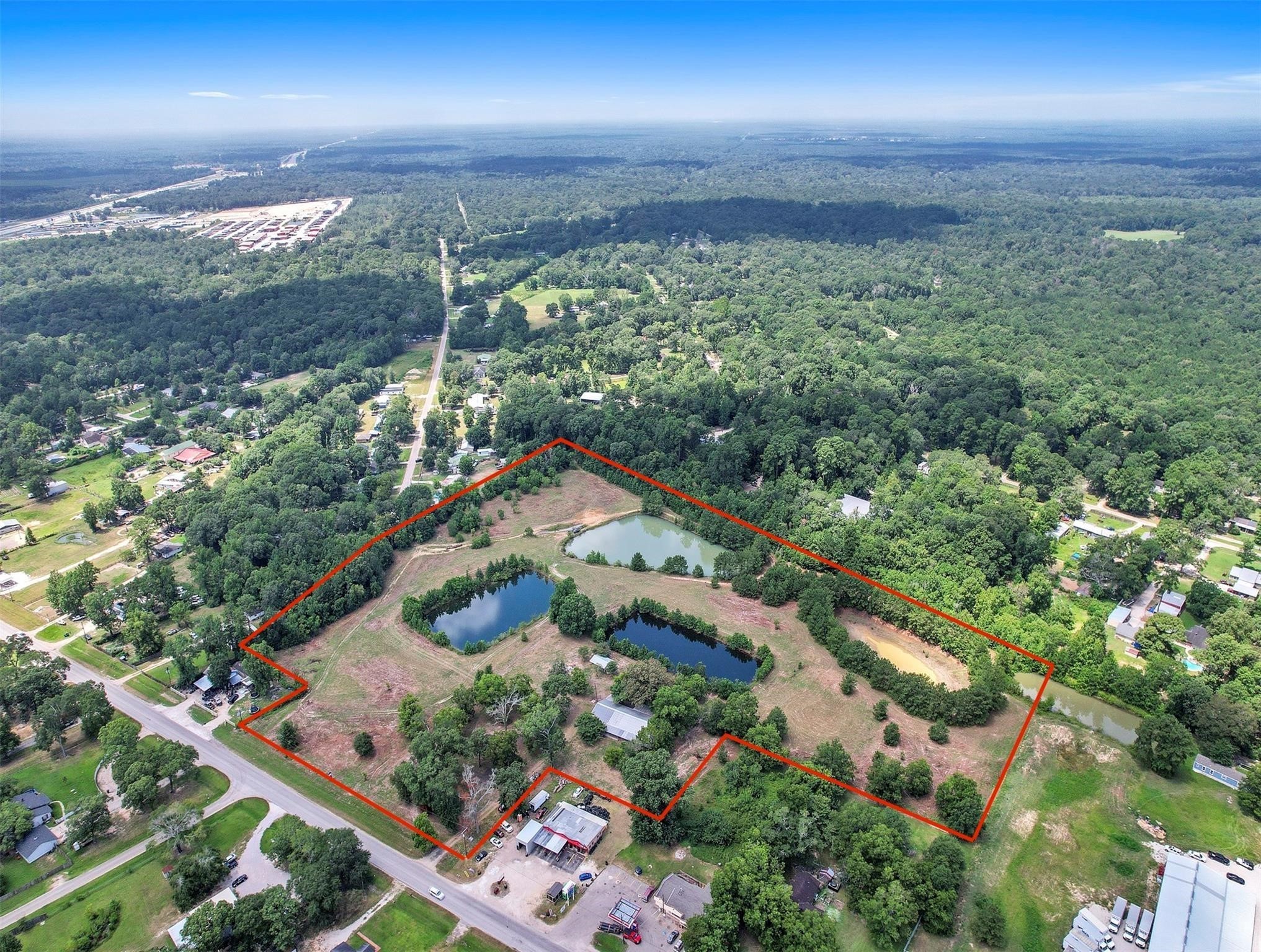 11304 Fostoria Road Cleveland, TX 77328 - Photo 31 of 32 an aerial view of residential houses with outdoor space