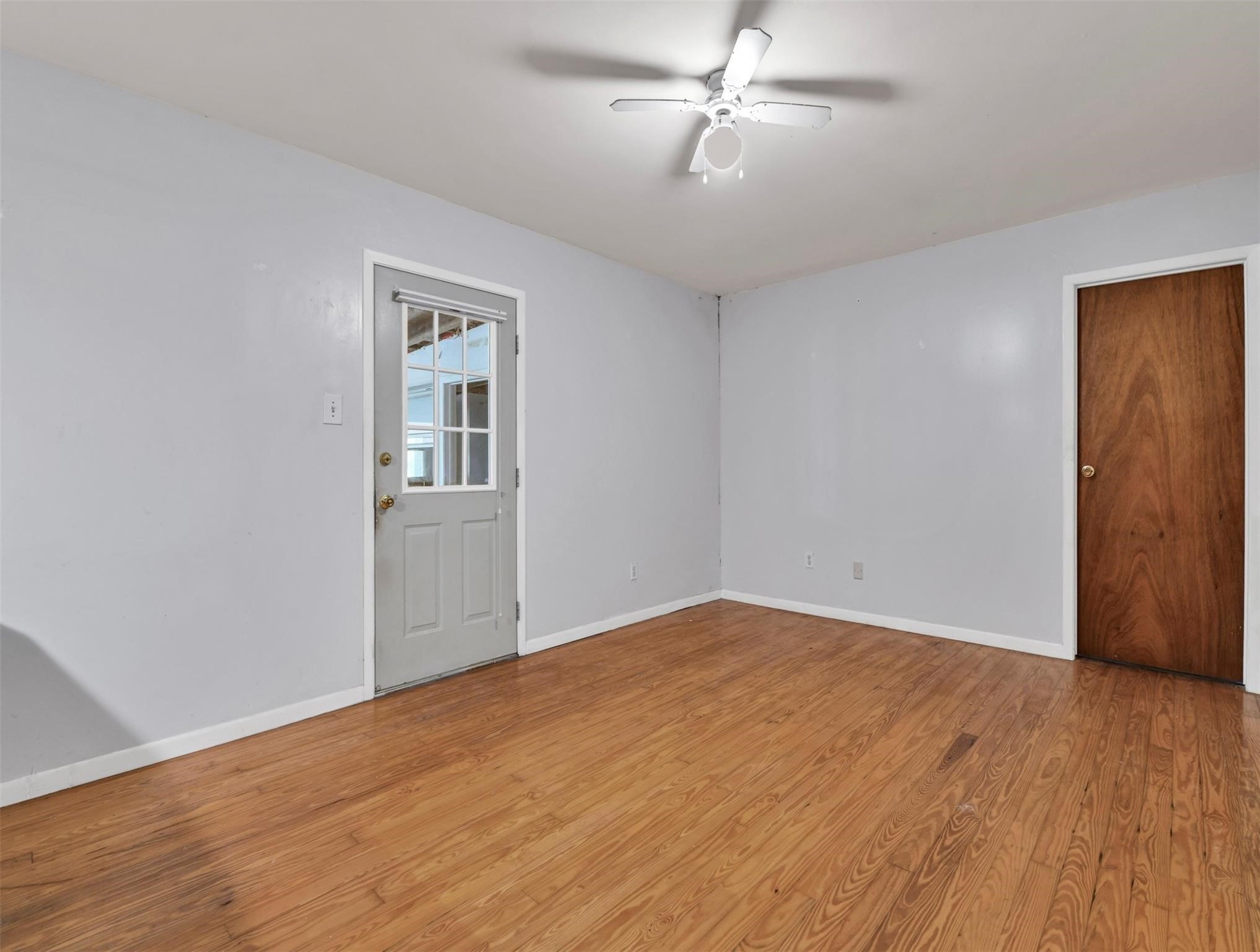 11304 Fostoria Road Cleveland, TX 77328 - Photo 9 of 32 a view of empty room with wooden floor