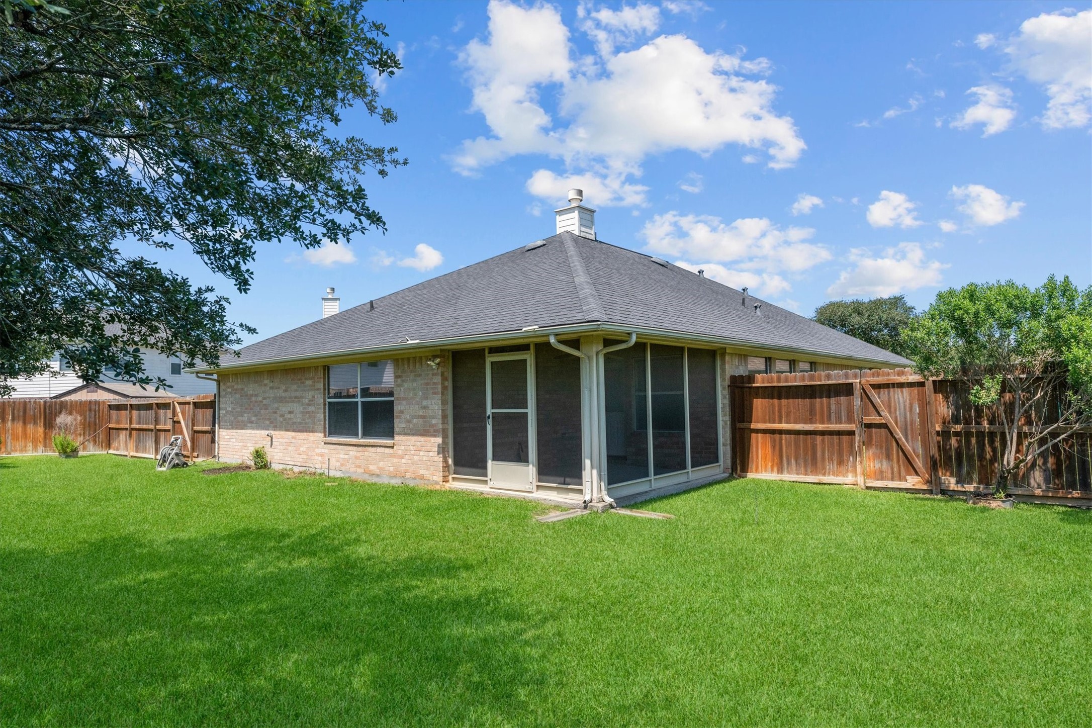 2507 Grayfeather Court Spring, TX 77388 - Photo 30 of 37 Exterior view of screened in porch and lush backyard.