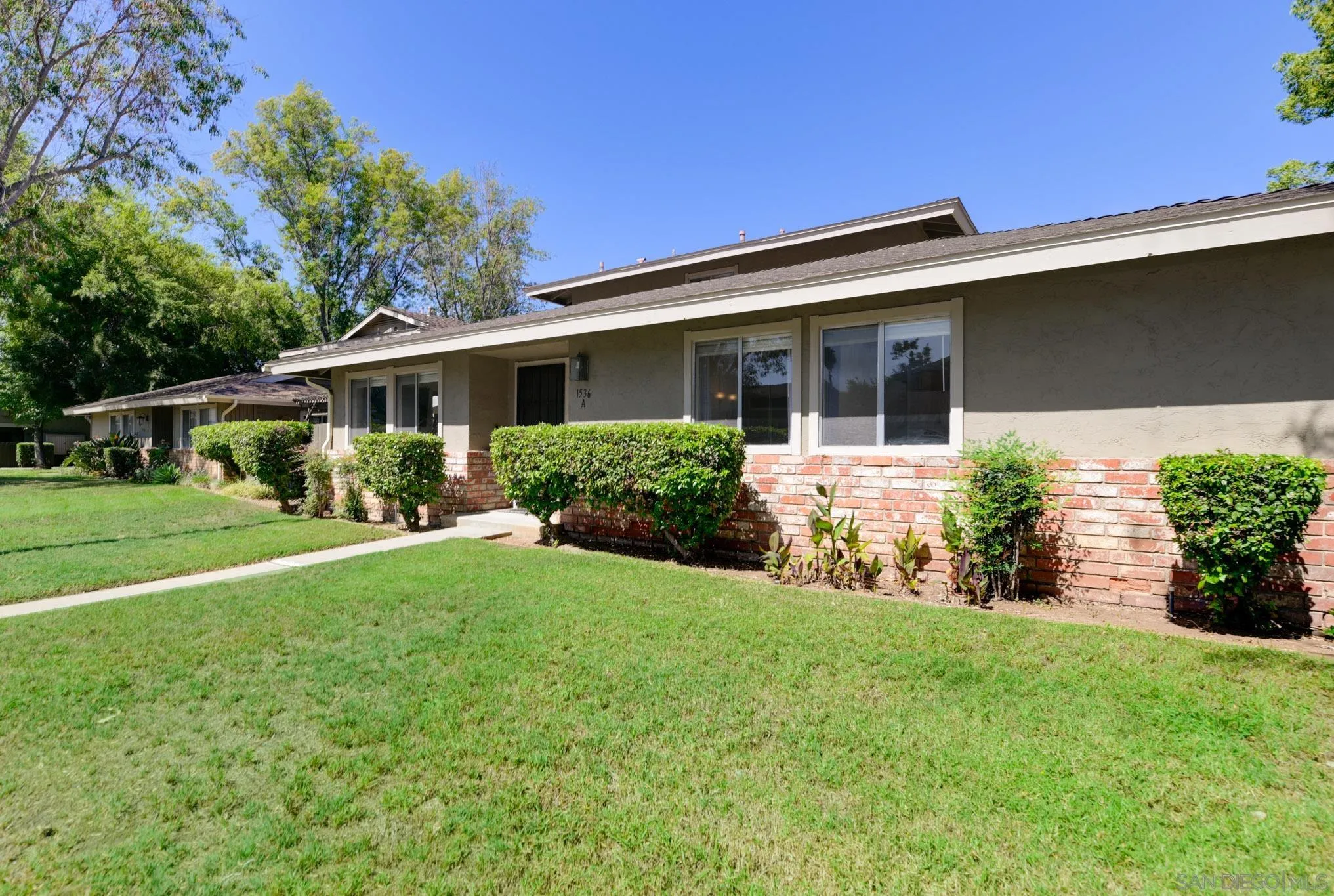 1536 Gustavo Street, Unit A El Cajon, CA 92019 - Photo 1 of 28 a front view of house with yard and green space