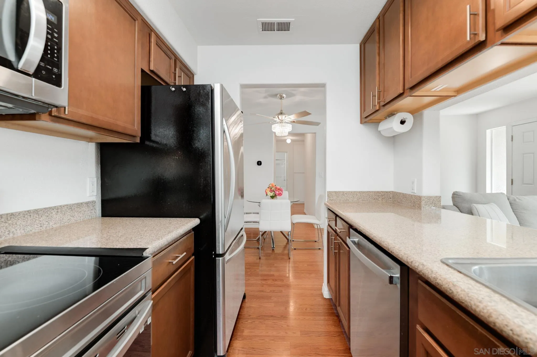 1536 Gustavo Street, Unit A El Cajon, CA 92019 - Photo 14 of 28 a kitchen with stainless steel appliances granite countertop a sink and a refrigerator