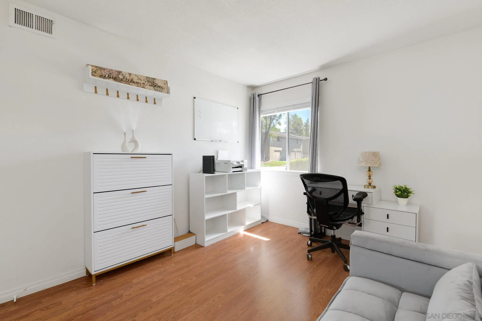 1536 Gustavo Street, Unit A El Cajon, CA 92019 - Photo 17 of 28 a view of a workspace with furniture and a window